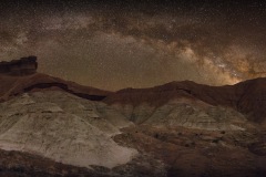 Milky Way arch over desert hills