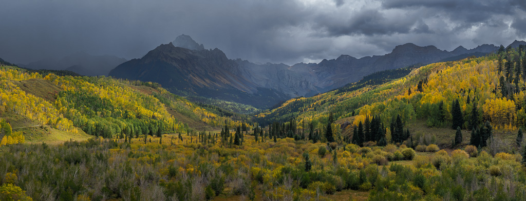 storm and aspens with mountain